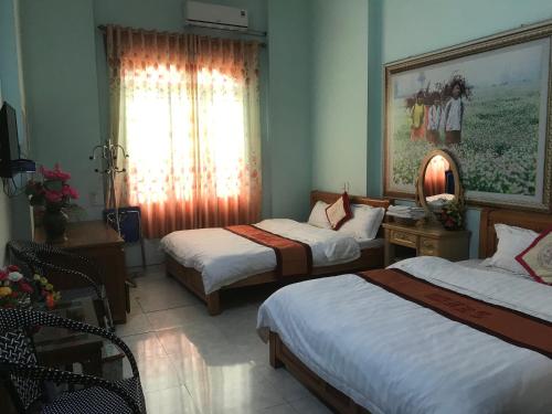 Postel nebo postele na pokoji v ubytování Yen Minh Hotel Thien An