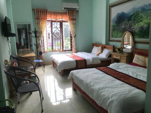 Postel nebo postele na pokoji v ubytování Yen Minh Hotel Thien An