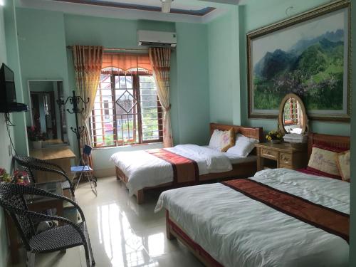 Ένα ή περισσότερα κρεβάτια σε δωμάτιο στο Thien An Guest House