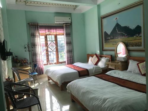 Ένα ή περισσότερα κρεβάτια σε δωμάτιο στο Thien An Guest House