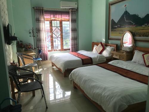 Ένα ή περισσότερα κρεβάτια σε δωμάτιο στο Thien An Guest House