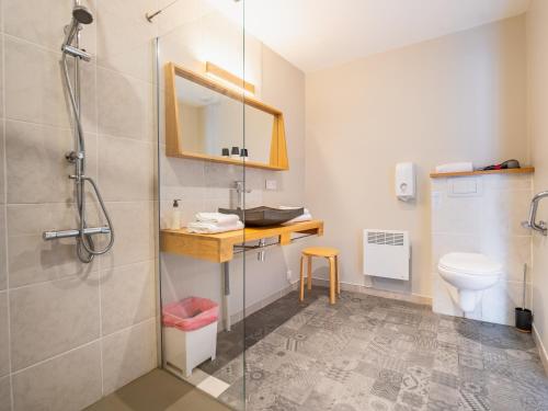 a bathroom with a shower and a sink and a toilet at Le Relais des Lacs Bourgogne Morvan in Planchez