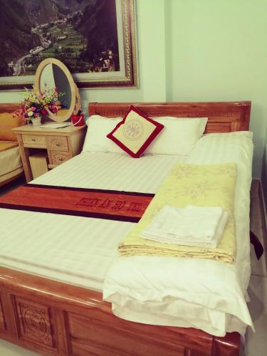 Ένα ή περισσότερα κρεβάτια σε δωμάτιο στο Thien An Guest House