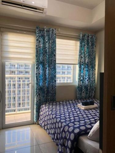 Shell Residences Homey Condo by DNJ