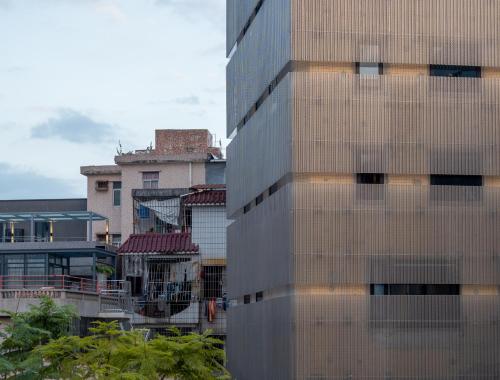 a tall building in a city with buildings at Jiangnan House Nantou in Shenzhen