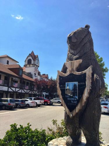 a statue of a bear with a sign on it at Meadow Harvest Suite with TV and private bathroom in Hemet