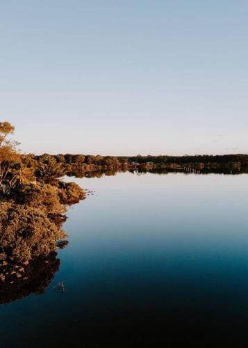 an aerial view of a body of water at Water's Edge in Culburra Beach