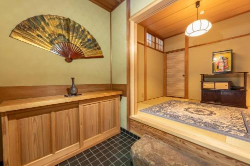 a room with a sauna with a fan at Traditional house/200sqm/good location/5BR/15Max in Kinugasa