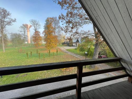 a view of a field from a window of a house at Atpūtas māja Sigulda in Sigulda