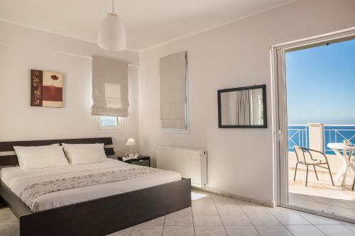 Кровать или кровати в номере Rhakotis Villa