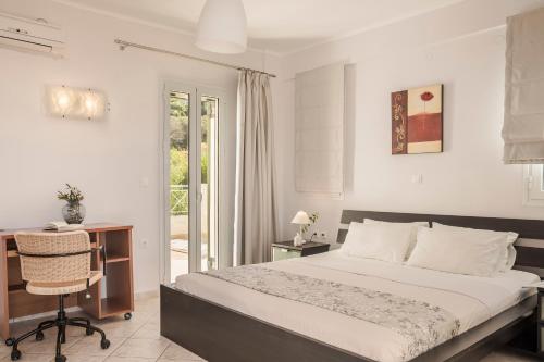 Кровать или кровати в номере Rhakotis Villa