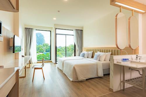 Postel nebo postele na pokoji v ubytování Infinity Aonang Krabi
