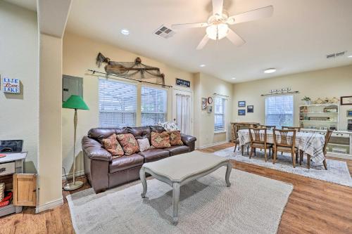 a living room with a couch and a table at Walk to Lake Townhome with Hot Tub in Afton! in Afton
