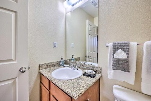 a bathroom with a sink and a toilet at Walk to Lake Townhome with Hot Tub in Afton! in Afton