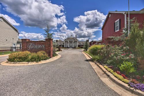 a street in a residential neighborhood with a house at Walk to Lake Townhome with Hot Tub in Afton! in Afton