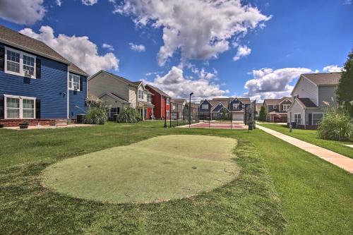 a putting green in a residential neighborhood with houses at Walk to Lake Townhome with Hot Tub in Afton! in Afton