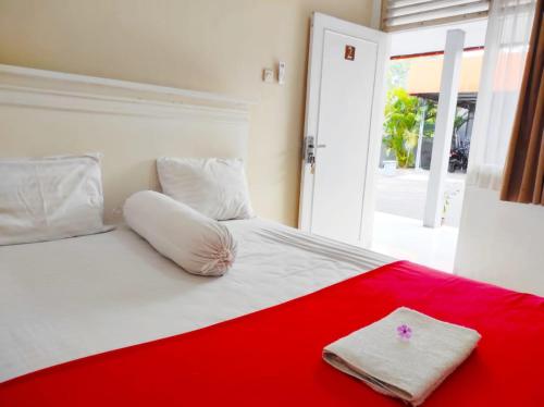Postel nebo postele na pokoji v ubytování Ratu Guesthouse