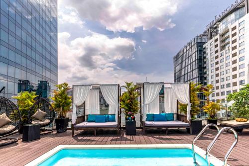 a pool on the roof of a building at Roseland Centa Hotel & Spa in Ho Chi Minh City