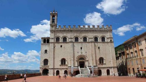 a building with a clock tower on top of it at Casa Lella in Fabriano