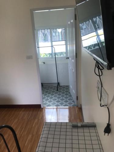 a view of a hallway with a tile floor at บ้านวิรา ห้องพัก Baan Wira in Khon Kaen