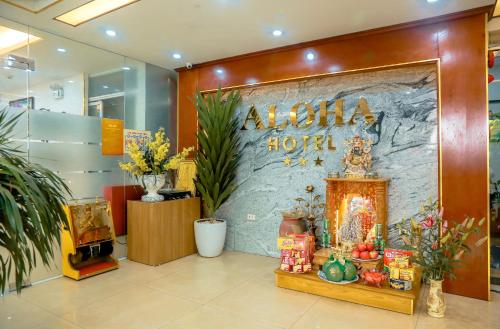 a store lobby with a sign that reads aloha shozai at Aloha Hotel in Hanoi