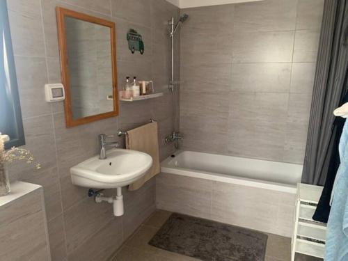 a bathroom with a sink and a bath tub at Sea of Galilee Tiberius apartment with panoramic sea view in Tiberias