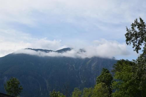 a mountain with clouds on top of it at Sieglhof in Breitenbach am Inn