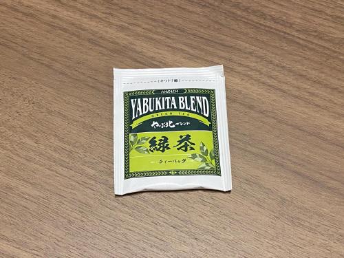 a bag of yakushima beer sitting on a table at Takanobashi HOTEL in Hiroshima
