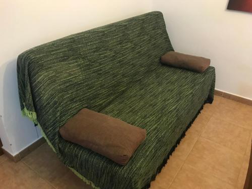 Кровать или кровати в номере Conil, Colorado 2 rustico y económico