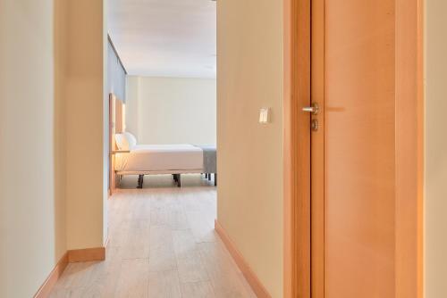 Postel nebo postele na pokoji v ubytování Smart Hotel La Sagra