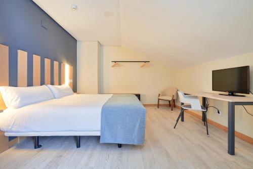 Postel nebo postele na pokoji v ubytování Smart Hotel La Sagra