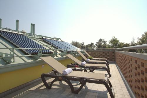 a row of benches on the roof of a building at Residenza Leo in Bibione