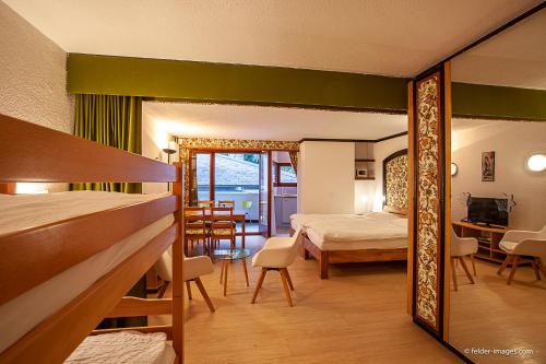 Postel nebo postele na pokoji v ubytování Hotel Astoria
