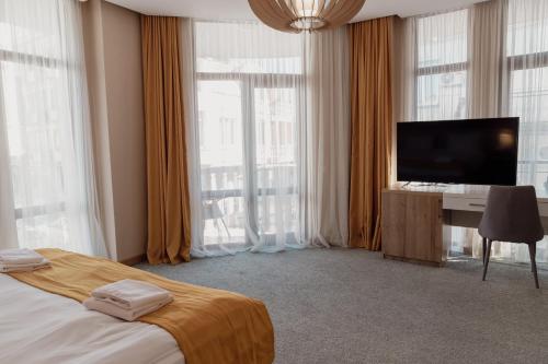 TV a/nebo společenská místnost v ubytování Hotel London