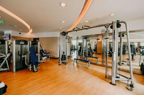 a gym with lots of treadmills and exercise equipment at Pudong Shangri-La Shanghai - With a sweeping view of the Pearl Tower and the historic Bund skyline in Shanghai