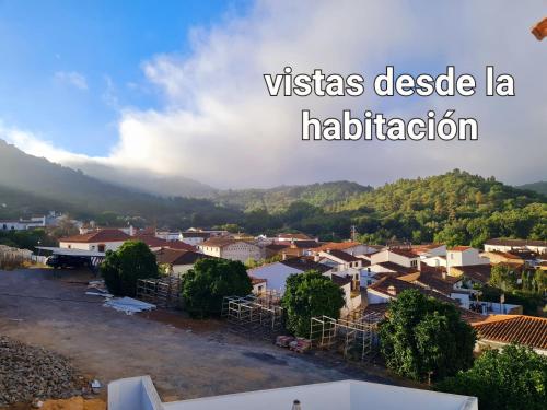 a view of a small town in a valley at La Casa Junto al Sendero del Río & Piscina # aire acondicionado in Los Romeros