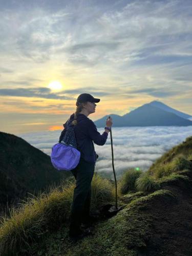 a woman standing on top of a mountain at Villa Danu Kintamani in Kintamani