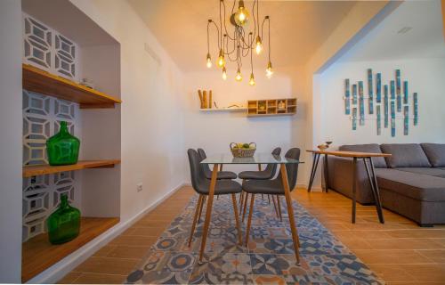 a living room with a table and a couch at Tamar Apartments in Lagos