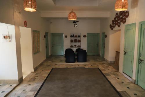 a hallway with two suitcases sitting in the middle of a room at The Brahma Space in Pushkar