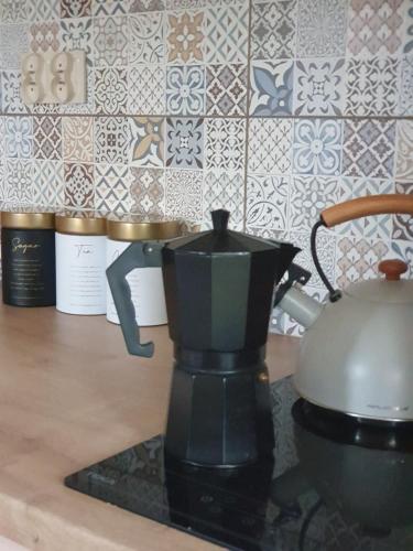 a coffee maker sitting on top of a counter at Domek na Polanie in Ustroń