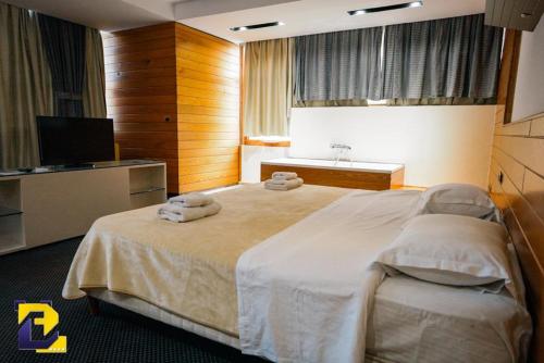 Ένα ή περισσότερα κρεβάτια σε δωμάτιο στο Hotel Bermon