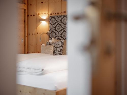 Postel nebo postele na pokoji v ubytování Alpen-Comfort-Hotel Central