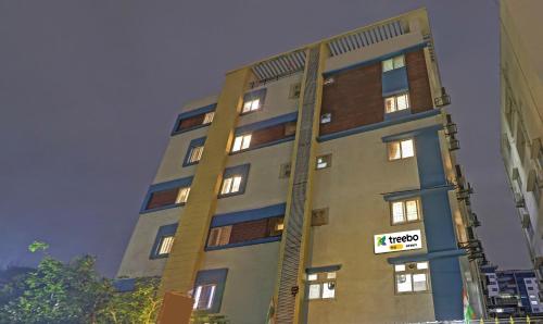 a tall building with a sign on the side of it at Itsy Hotels Infinity, Hitech City in Hyderabad