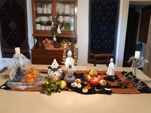 a table topped with a display of fruit and vegetables at B&B Il Giardino di Paola in Alliste