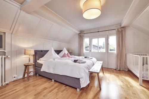 a bedroom with a large bed and a window at Ferienhaus Waxenstein in Garmisch-Partenkirchen