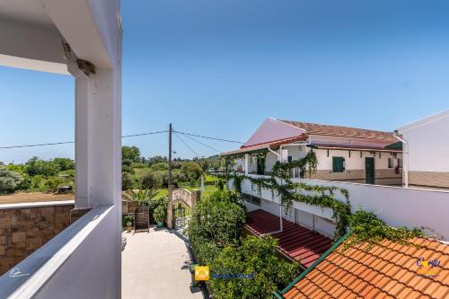 a view from the balcony of a house at Chandris Apartments in Kavos