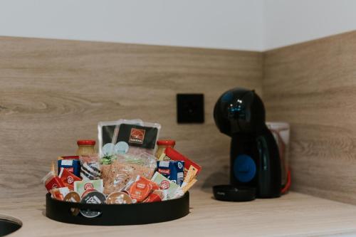 a basket of food on a table next to a telephone at Casa La Picuda in San Vicente de la Sonsierra