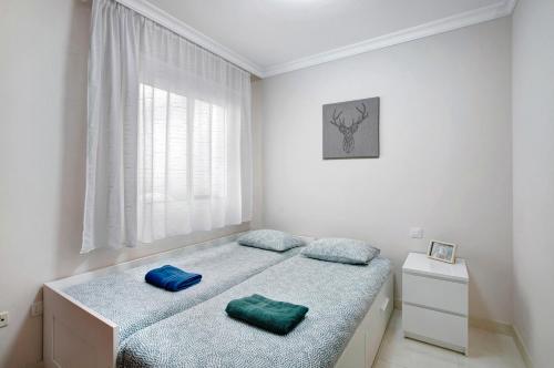 a bedroom with two beds and a window at Isla Bonita San Juan Beach in Guía de Isora