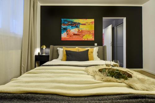 a bedroom with a large bed with a rug on it at Lemonade - Stylish 1BR Apartment in Obor District in Bucharest