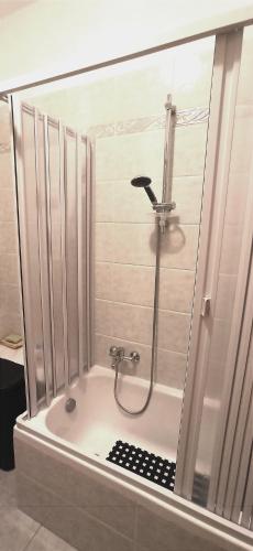 a shower in a bathroom with a glass wall at Contessa Vacanze Byron in Contessa Entellina